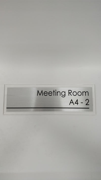 Meeting room metallic texture signage