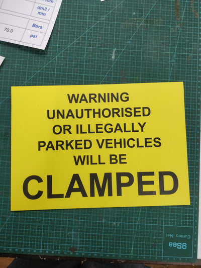 Warning unauthorised or illegally parked vehicles will be clamped