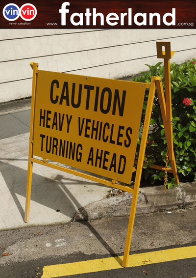 CAUTION HEAVY VEHICLE TURNING AHEAD OUTDOOR SIGN
